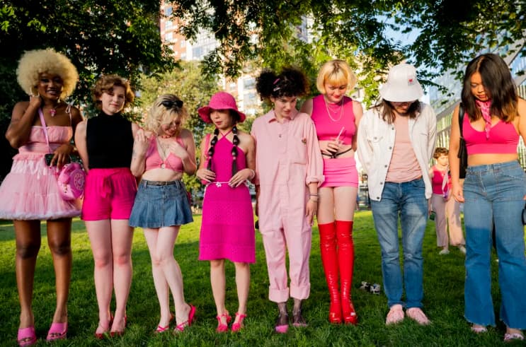 a group of friends dressed up to Barbie for a July 20 show the AMC movie theater